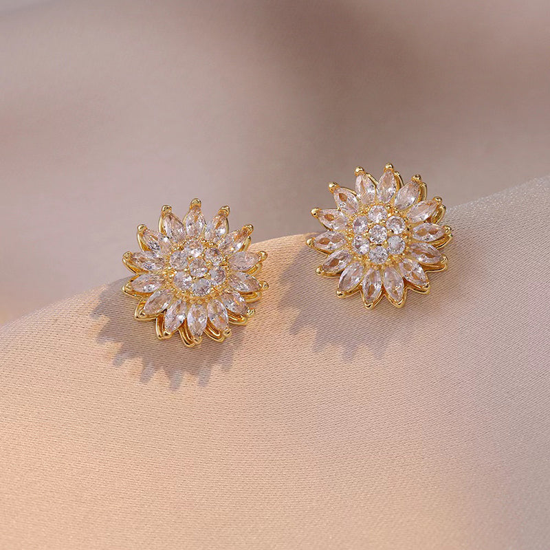 Aretes Girasol Giratorio: Amor y Luz